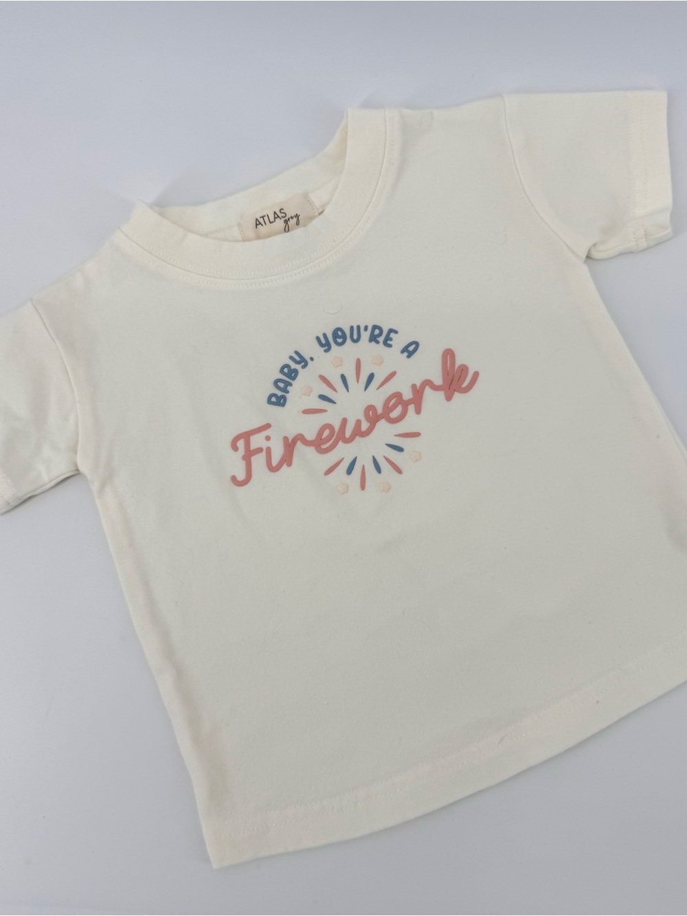 Atlas Grey Baby “Baby You're A Firework” Graphic Tee - Cream